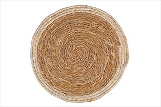 Top view of round weave wicker placemat on white background,
