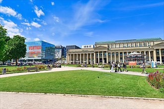 Town square and public park called Schlossplatz with old historic shopping center building and modern art museum on sunny day,