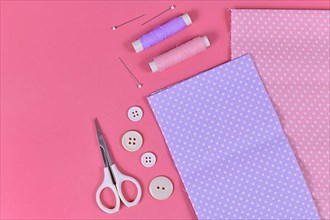 Flat lay with various sewing tools like fabric, scissors