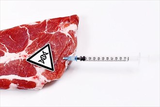 Concept for genetically modified animals with meat with injected syringe and DNA symbol,