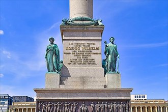 Inscription at monument called Jubileumssaeule with allegorical figures at palace square in Stuttgart city,
