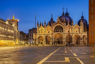 St. Mark's Square with clock tower and St. Mark's Basilica at dusk, Venice