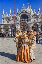 St. Mark's Square with Carnival Masks in front of St. Mark's Basilica, Venice