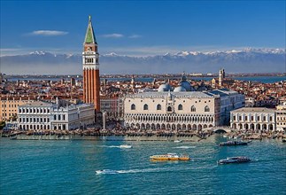 Waterfront on the lagoon with Piazzetta, Campanile and Doge's Palace in front of the Alpine chain