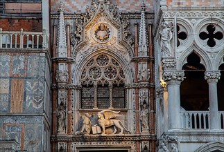 Entrance portal to the Doge's Palace with sculpture of the Doge and winged lion, Venice