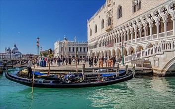 Gondola on the waterfront with Doge's Palace, Venice