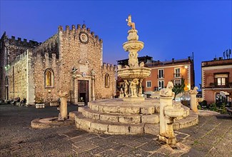 Cathedral square with fountain and cathedral at dusk, Taormina