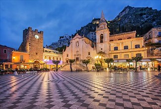 Belvedere Piazza IX Aprile with clock tower and church of San Giuseppe at dusk, Taormina