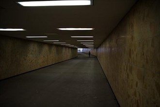 A woman in the pedestrian subway at Springpfuhl S-Bahn station, Marzahn-Hellersdorf district