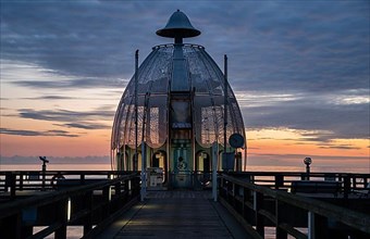 Diving gondola of the pier Sellin in the sunrise on the island of Ruegen, Germany