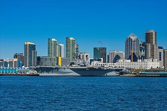 Skyline of San Diego with the USS Midway, California