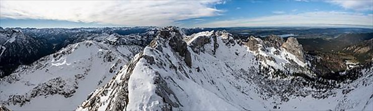 Panorama with mountain landscape, rocky snowy mountain ridge of the Ammergauer Hochplatte