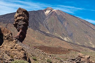 View of flank and summit of volcano Teide highest mountain of Spain, left foreground lava formation Devil's Finger
