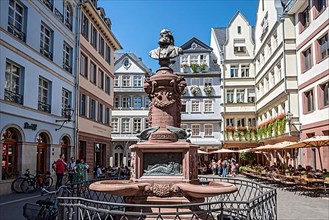 Monument to Friedrich Stoltze, modern and reconstructed town houses with shops and street cafes on Huehnermarkt