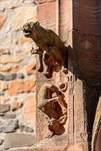 Medieval mythical creatures, gargoyles on the portal of the porch