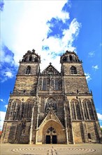 Magdeburg Cathedral under a blue sky with white clouds. Saxony-Anhalt, Germany