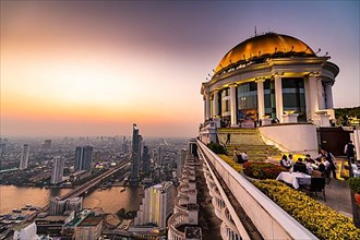 Sunset over Bangkok and the Chao Phraya River with the dome of Lebua tower, Bangkok