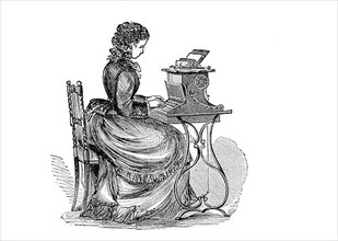 Woman working at a typewriter, secretary
