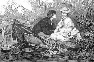 Young lovers sitting in a rowing boat, hidden in the reeds and he flirts with the woman