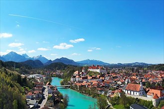 Aerial view of Fuessen with a view of the Lech river, the Benedictine monastery of St. Mang and the high castle. Ostallgaeu Swabia