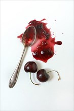 Cherry jam with spoon, cherries