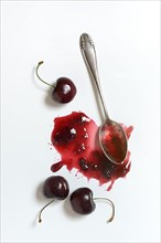 Cherry jam with spoon, cherries