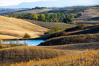 Reservoir in hilly landscape, near Siena