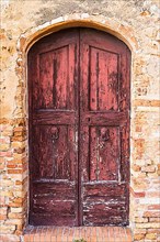 Weathered old house door, San Gimignano