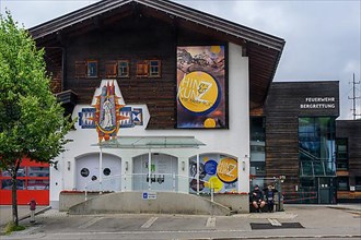 House with mural, tourist info