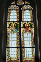 Colourful stained glass window mi St. Peter and St. Paul, Catholic Parish Church