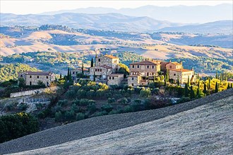 Country houses in the hilly landscape of the Crete Senesi, near Asciano