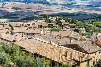 Above the rooftops of Montalcino, view of the Val dOrcia valley
