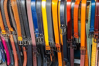 Coloured belts at a stall at the weekly market market in Buonconvento, Val dOrcia