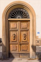 Ornate round arch front door, Florence