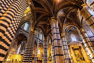 Black and white marble columns in Siena Cathedral, Siena