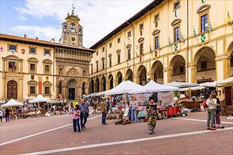 Stalls at the antique market in the old town of Arezzo, Piazza Grande