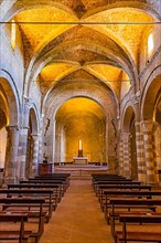 The illuminated ceiling vault of Sovana Cathedral, view to the altar