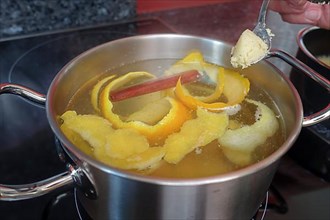 Swabian cuisine, preparation of sweet semolina dumplings in hot water with oranges and lemon zest