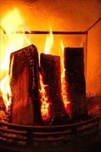 Cosy stove fire with burning logs,