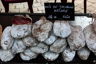 Nut ham, ham sale at the market in Souillac in the Lot department in the far north-west of the Occitanie region in southern France