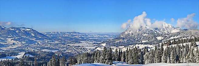 Wonderful winter landscape under a blue sky with a view of the Alpine foothills. Sonthofen, Oberallgaeu