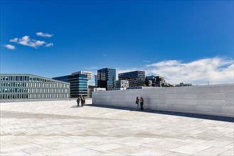 Pedestrians on the white roof of the opera house, modern architecture