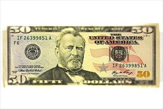 A fifty dollar note graphically altered or tilt shift effect,