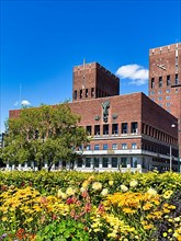 Monumental red brick city hall with two towers, architects Arnstein Arneberg and Magnus Poulsson