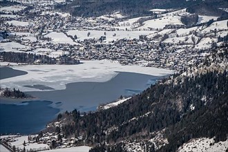 View from the top of the Jagerkamp to Schliersee and village, mountains in winter