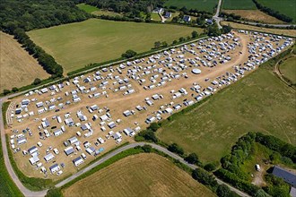 Aerial view of Gens de Voyage or Travelling People camp set up without permission in a field in Dirinon, Finistere Penn-ar-Bed department