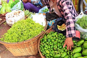 Vegetable vendors at Mani Sithu Market. Nyaung-U, Myanmar