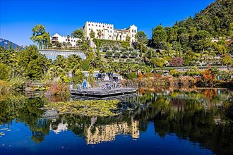 The Gardens of Trauttmansdorff Castle with reflections in the water lily pond, near Merano