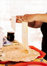 Preparation of traditional Nicaraguan cheese, Preparation of traditional Nicaraguan cheese. Nicaraguan cheese made and served. Traditional cheese with pickled onion
