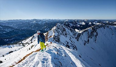 Ski tourers in winter on the snow-covered Rotwand, mountains in winter